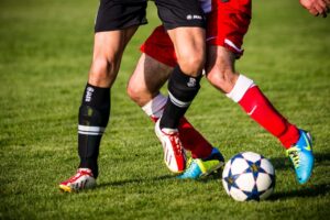 soccer players fighting for the ball