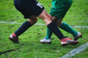 soccer players fighting for the ball