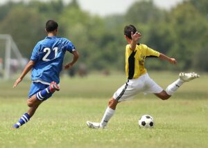 soccer player running in a soccer match