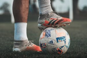 A Player Stepping on a Soccer Ball