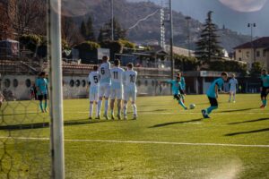 soccer player taking a free kick