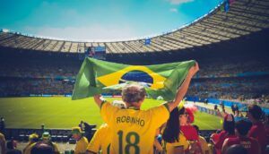 man raising yellow flag in his hand