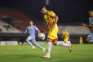 soccer player playing with ball