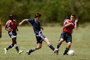 soccer players playing in an open field