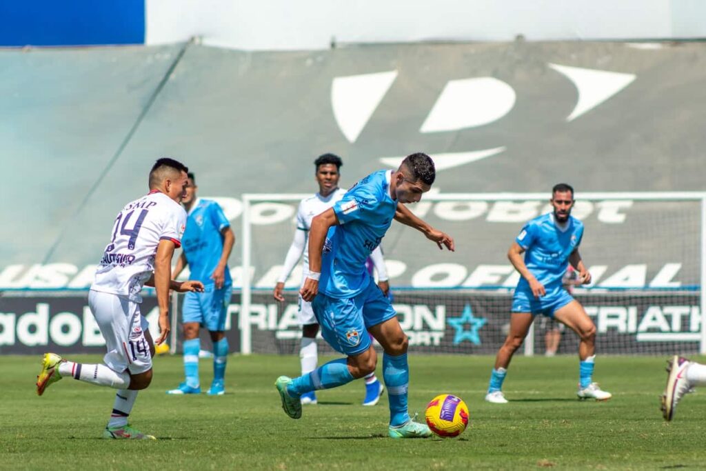 soccer players playing in the field